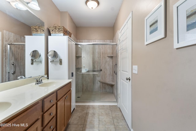 bathroom featuring vanity, an enclosed shower, and tile patterned flooring