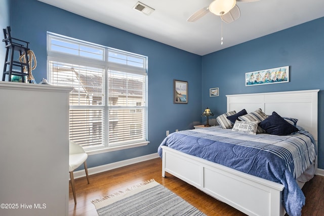 bedroom featuring wood-type flooring and ceiling fan