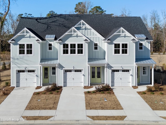 modern inspired farmhouse with a garage