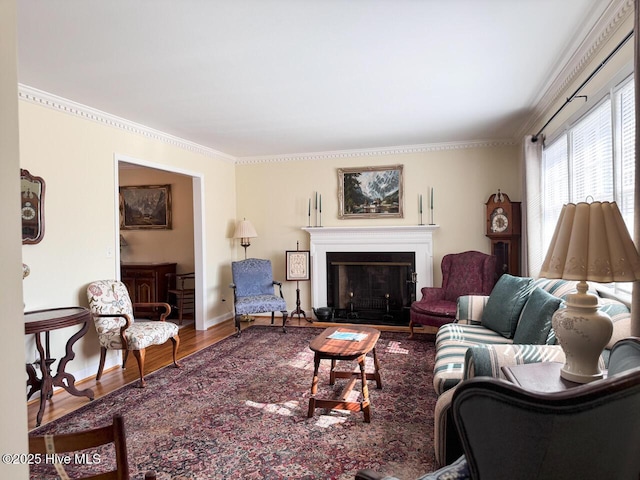 living room with crown molding and hardwood / wood-style floors