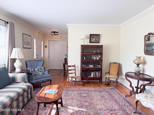 living room featuring hardwood / wood-style flooring and crown molding