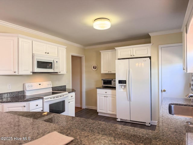 kitchen featuring crown molding, sink, white appliances, and white cabinets