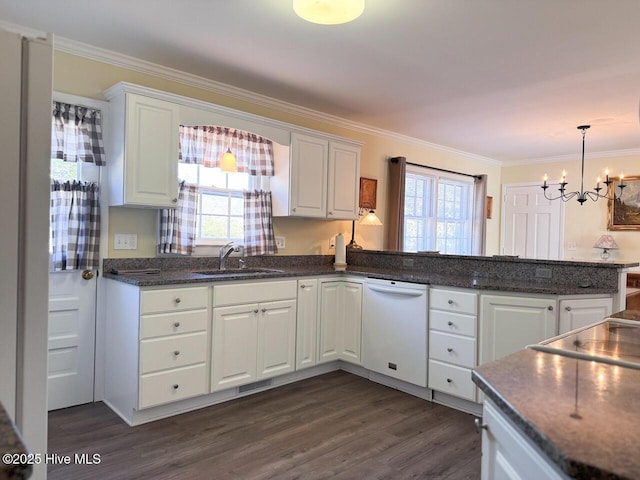 kitchen featuring white cabinetry, kitchen peninsula, and sink