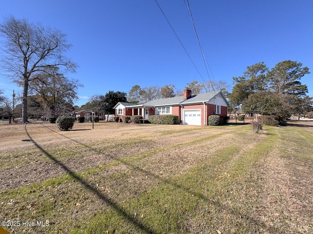 view of yard with a garage