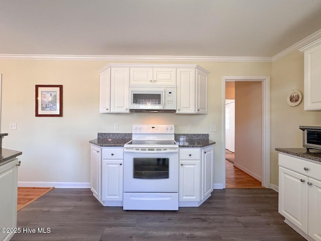 kitchen with white appliances, dark wood-type flooring, crown molding, white cabinetry, and dark stone counters