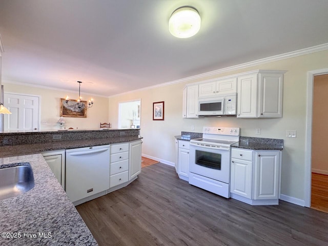 kitchen with white cabinetry, white appliances, crown molding, and hanging light fixtures