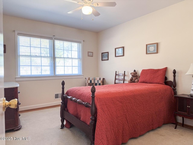 bedroom featuring ceiling fan and light colored carpet