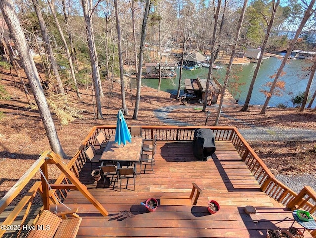 wooden deck with a water view