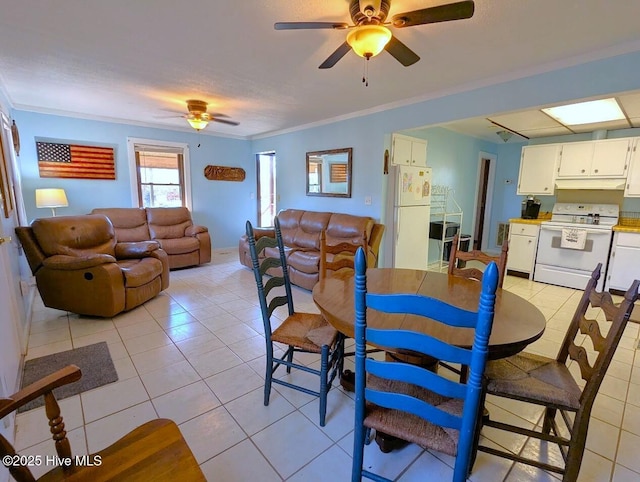 dining area with light tile patterned floors, ornamental molding, and ceiling fan