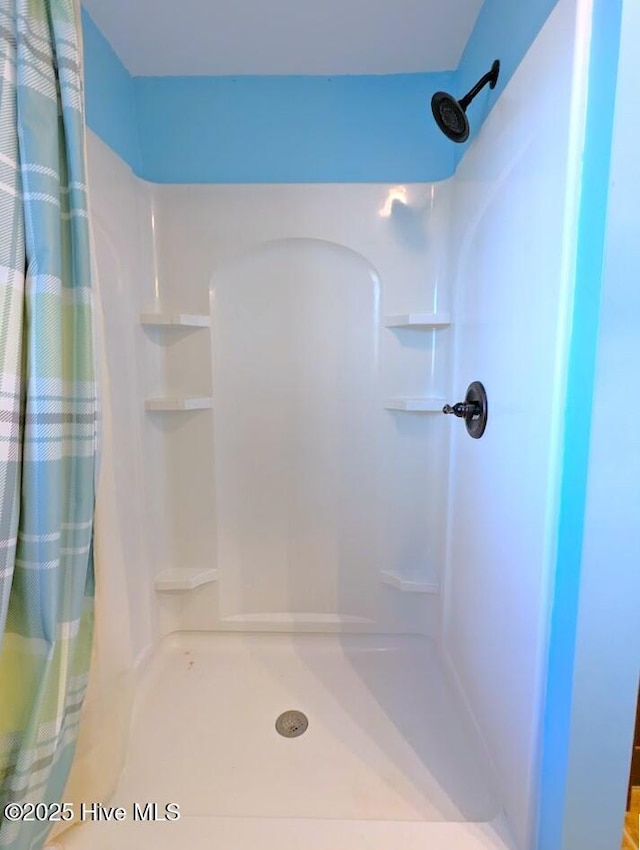 bathroom with a shower with curtain