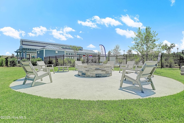 view of property's community with fence, a patio, and a yard