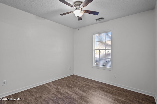 unfurnished room with ceiling fan, hardwood / wood-style floors, and a textured ceiling