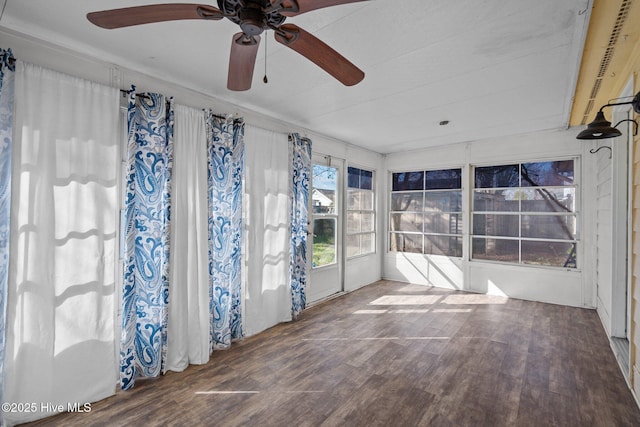 unfurnished sunroom with ceiling fan