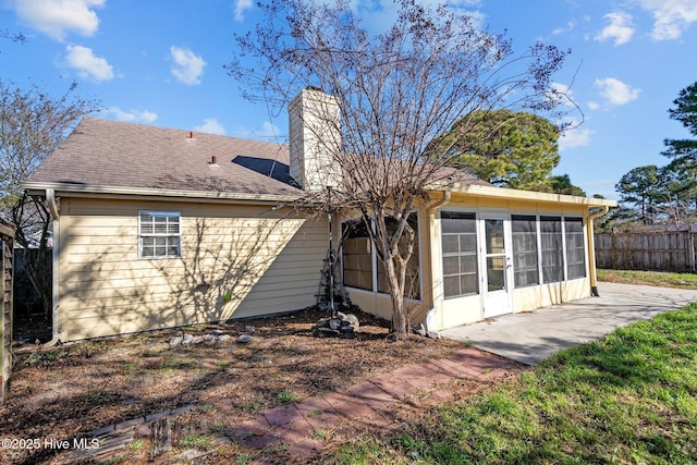 rear view of house with a sunroom