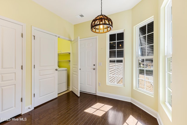 entryway featuring washer / dryer and dark hardwood / wood-style floors