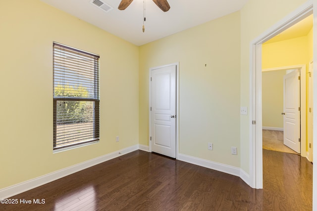 unfurnished bedroom featuring dark hardwood / wood-style flooring