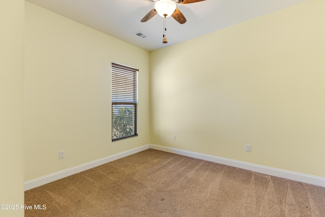 carpeted empty room with ceiling fan