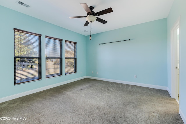 spare room with ceiling fan and carpet flooring