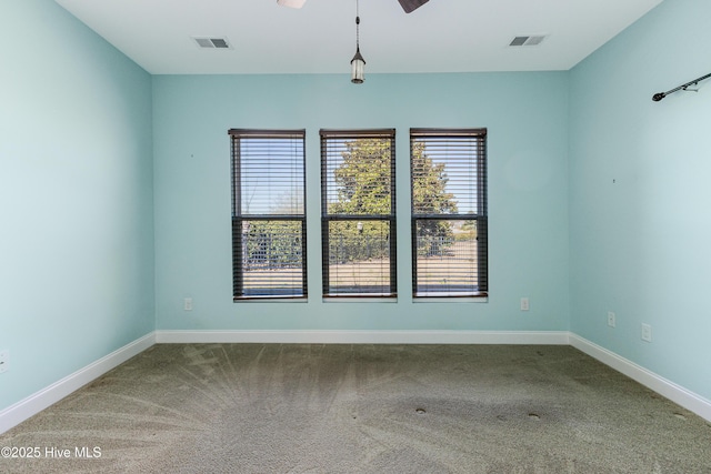 unfurnished room with carpet flooring