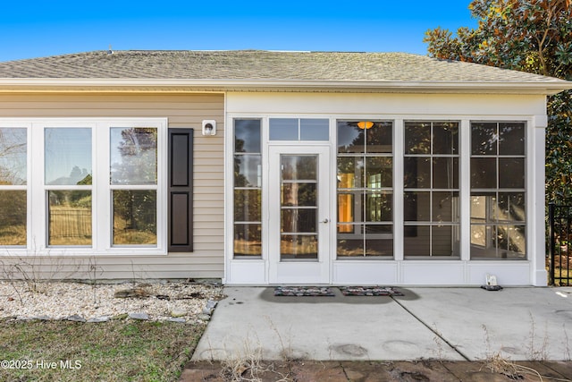 doorway to property featuring a patio