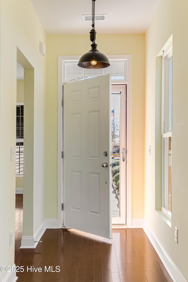 foyer with dark hardwood / wood-style flooring