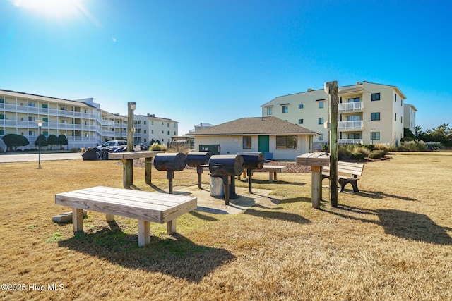 view of home's community featuring a lawn