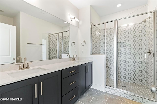 bathroom featuring walk in shower, tile patterned floors, and vanity