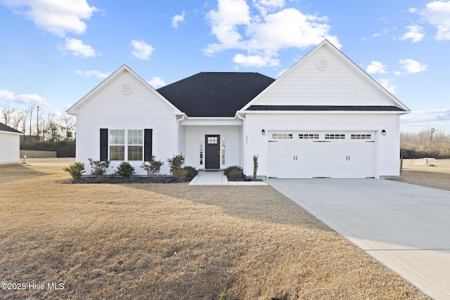 ranch-style home featuring a garage and a front lawn