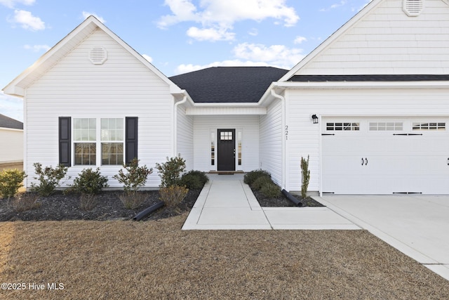 view of front of property featuring a garage