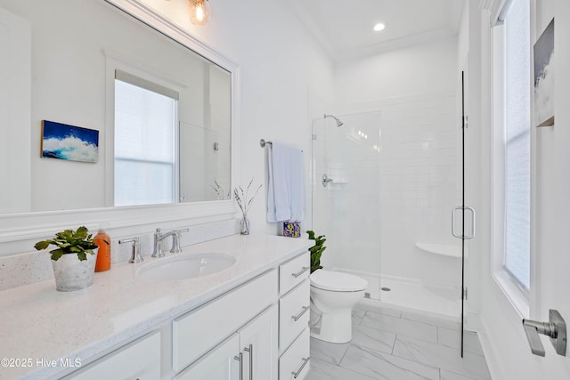 740 Waterstone Dr, Wilmington, NC 28411 - bathroom featuring vanity, a shower stall, toilet, marble finish flooring, and healthy amount of natural light