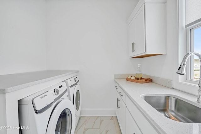 740 Waterstone Dr, Wilmington, NC 28411 - laundry area with cabinet space, separate washer and dryer, light marble finish floors, and baseboards
