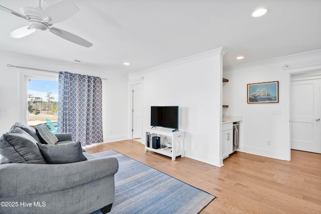 740 Waterstone Dr, Wilmington, NC 28411 - living room featuring recessed lighting, a ceiling fan, baseboards, light wood-type flooring, and crown molding