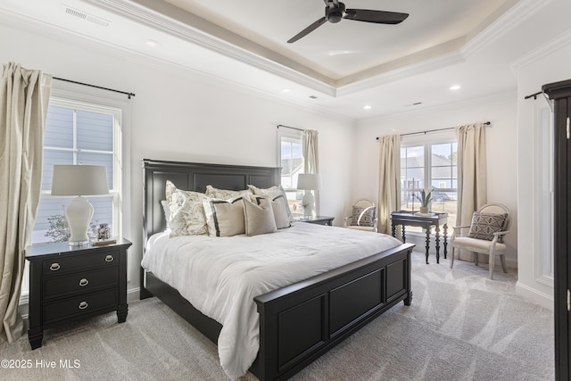 bedroom featuring multiple windows, light carpet, and visible vents