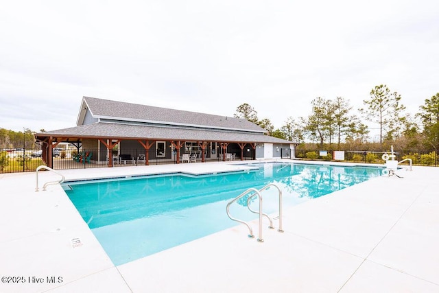 pool featuring a patio and fence