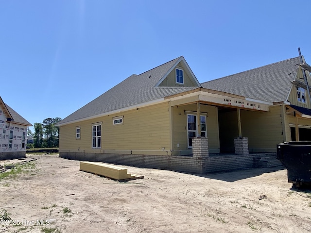 back of property with board and batten siding