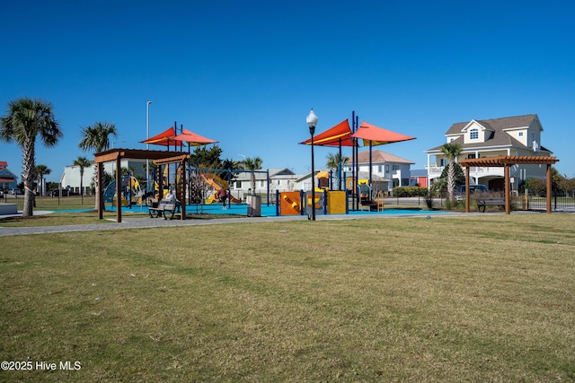 view of playground with a yard and a pergola