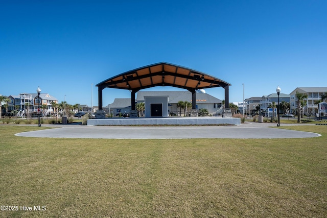 view of property's community with a gazebo and a lawn