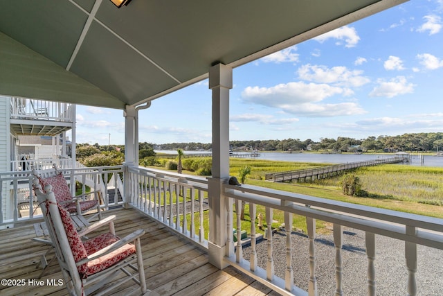 wooden deck featuring a water view