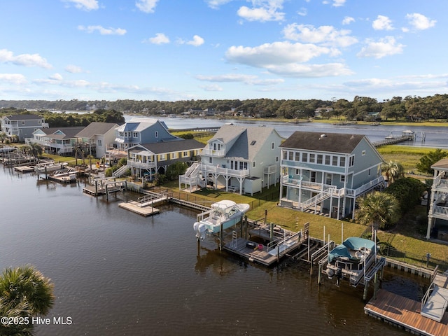 drone / aerial view featuring a water view and a residential view