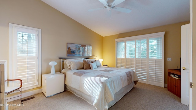 carpeted bedroom with lofted ceiling and ceiling fan