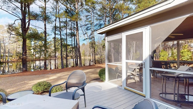 wooden deck with a sunroom