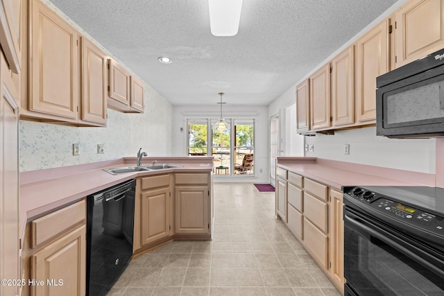 kitchen featuring light tile patterned flooring, sink, decorative light fixtures, light brown cabinets, and black appliances