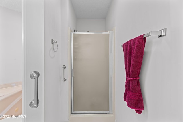 bathroom with vanity and a shower with shower door