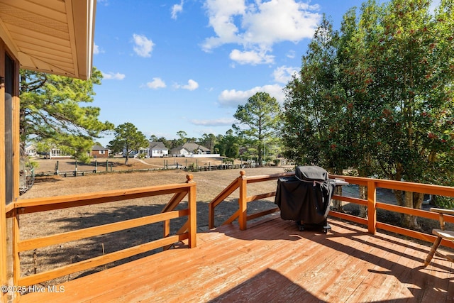 wooden deck featuring grilling area