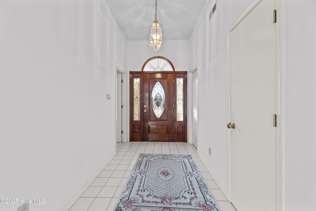 foyer with light tile patterned flooring