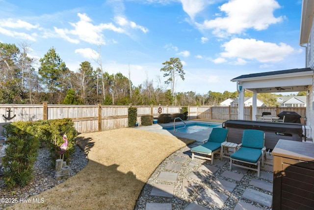 view of pool with a jacuzzi and a patio area