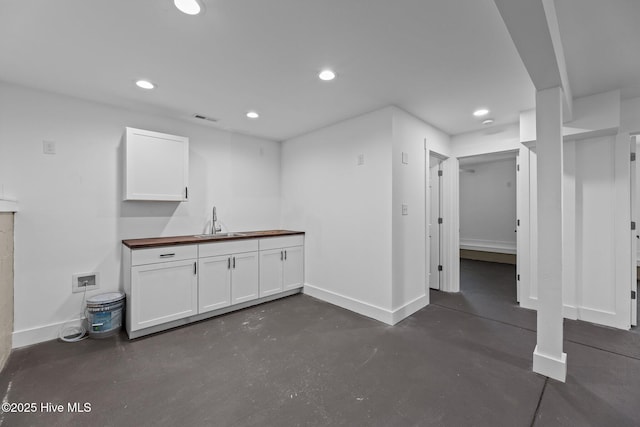 interior space with sink and concrete floors