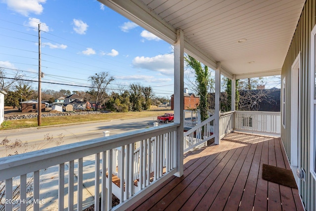 wooden deck featuring covered porch