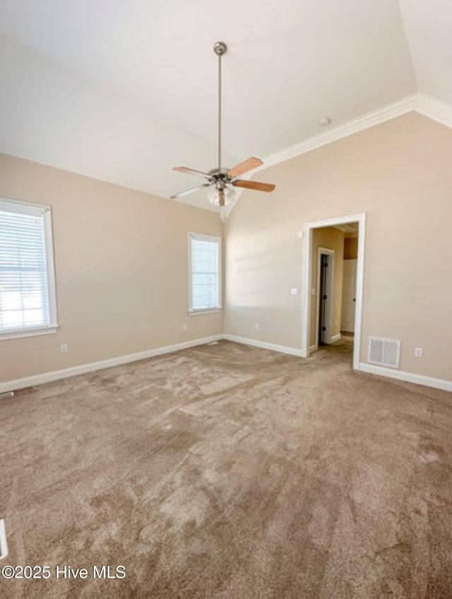 carpeted empty room with lofted ceiling and ceiling fan