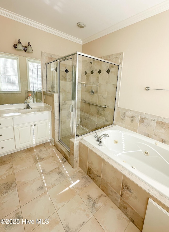 bathroom with crown molding, vanity, and shower with separate bathtub